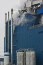 Steam coming out of an industrial facility, factory. Air pollution caused by smoke from the factoryÃ¢â¬â¢s chimney. Royalty Free Stock Photo
